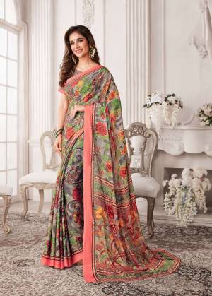Go Colorful Wearing This Pretty Looking Saree In Multi Color Paired With Beige Colored Blouse. This Saree And Blouse Are Georgette Based Beautified With Prints All Over It.