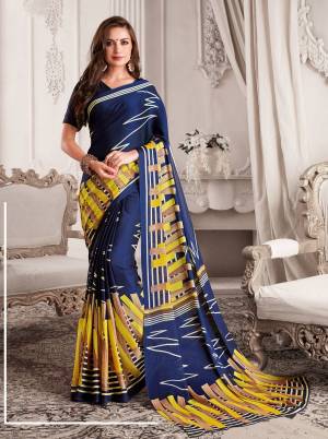 Enhance Your Personality Wearing This Lovely Saree In Navy Blue Color Paired With Navy Blue Colored Blouse. This Saree And Blouse Are Georgette Based Beautified With Contrasting Bold Prints. Buy Now.