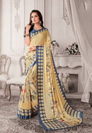 Simple And Elegant Looking Saree Is Here In Cream Color Paired With Grey Colored Blouse. This Saree And Blouse Are Fabricated On Georgette Beautified with Contrasting Colored Prints. Buy Now.