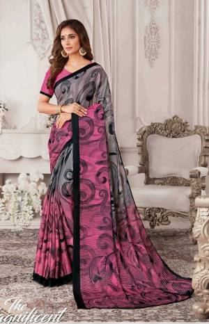 Look Pretty In This Rich and Elegant Looking Grey And Pink Colored Saree Paired With Pink Colored Blouse. This Saree And Blouse Are Georgette Based Beautified With Black Colored Prints All Over It.