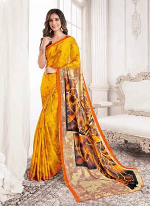 Celebrate This Festive Season With Beauty And Comfort Wearing This Pretty saree In Yellow Color Paired With Yellow Colored Blouse. This Saree And Blouse Are Fabricated On Georgette Beautified With Simple Prints All Over It.