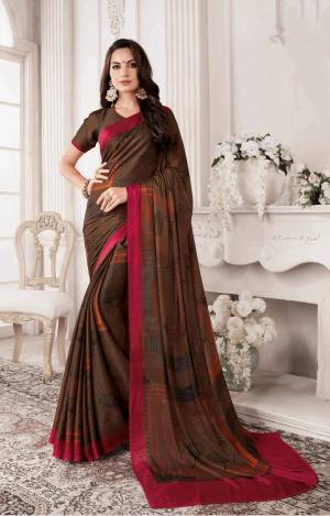 Enhance Your Personality Wearing This Lovely Saree In Dark Brown Color Paired With Dark Brown Colored Blouse. This Saree And Blouse Are Georgette Based Beautified With Contrasting Bold Prints. Buy Now.