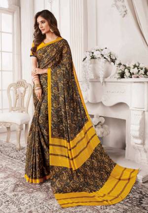 You Will Definitely Earn Lots Of Compliments Wearing This Designer Printed Saree In Dark Grey And Yellow Color Paired With Musturd Yellow Colored Blouse. This Saree and Blouse Are Fabricated On Georgette Beautified With Prints All Over. 