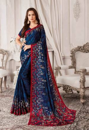 Enhance Your Personality Wearing This Lovely Saree In Navy Blue Color Paired With Navy Blue Colored Blouse. This Saree And Blouse Are Georgette Based Beautified With Contrasting Prints. Buy Now.