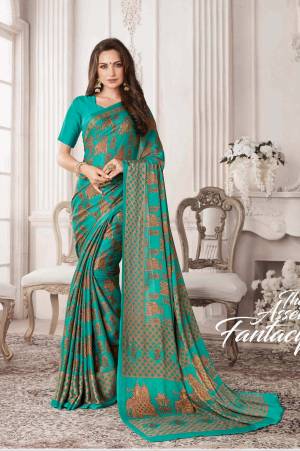 For Your Casual Or Semi-Casual Wear, Grab This Saree In Turquoise Blue Color Paired With Turquoise Blue Colored Blouse. This Saree And Blouse Are Georgette Based Beautified With Prints All Over It.