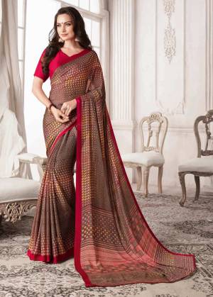 Flaunt Your Rich and Elegant Taste Wearing This Printed Saree In Brown Color Paired With Contrasting Magenta Pink Colored Blouse. This Saree And Blouse Are Georgette Based With Intricate Prints.