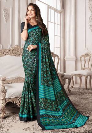 For a Bold and Beautiful Look, Grab This Saree In Black Color Paired With Black Colored Blouse. This Saree And Blouse are Georgette Based Beautified With Contrasting Green And Blue Colored Floral Prints All Over The Saree.