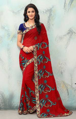 Adorn A Pretty Angelic Look Wearing This Designer Saree In Red Color Paired With Contrasting Navy Blue Colored Blouse. This Saree Is Fabricated On Georgette Paired With Art Silk Fabricated Blouse. It Is Beautified With Contrasting Embroidery All Over It. 