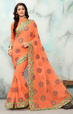 Add This Very Pretty Dark Peach Colored Saree Paired With Dark Peach Colored Blouse. This Saree And Blouse Are Georgette Based Beautified With Contrasting Colored Resham Thread Work . Buy This Designer Saree Now.