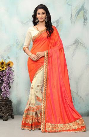 Celebrate This Festive Season With Beauty And Comfort Wearing This Designer Saree In Orange And Cream Color Paired With Cream Colored Blouse. This Saree Is Fabricated On Paper Silk And Georgette Paired With Art Silk Fabricated Blouse. Buy This Saree Now.