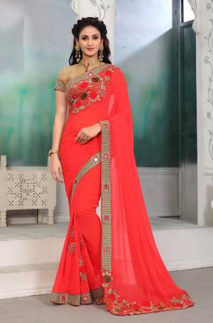 You Will Definitely Earn Lots Of Compliments Wearing This Designer Saree In Crimson Red Shade Paired With Beige Colored Blouse. This Saree Is Fabricated On Georgette Paired With Art Silk Fabricated Blouse. Buy This Designer Saree Now.