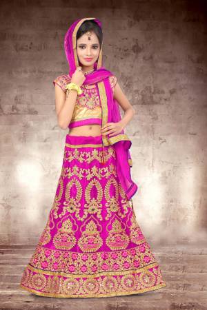 Make Your Girl Look The Prettiest Of All With This Heavy Designer Lehenga Choli In Golden Colored Blouse Paired With Rani Pink Colored Lehenga And Dupatta. It Is Beautified With Heavy Jari Embroidery And Stone Work. Buy Now.