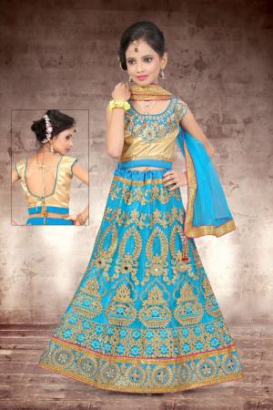 Make Your Girl Look The Prettiest Of All With This Heavy Designer Lehenga Choli In Golden Colored Blouse Paired With Blue Colored Lehenga And Dupatta. It Is Beautified With Heavy Jari Embroidery And Stone Work. Buy Now.