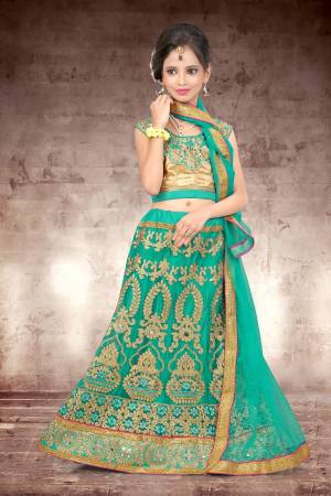 Make Your Girl Look The Prettiest Of All With This Heavy Designer Lehenga Choli In Golden Colored Blouse Paired With Green Colored Lehenga And Dupatta. It Is Beautified With Heavy Jari Embroidery And Stone Work. Buy Now.