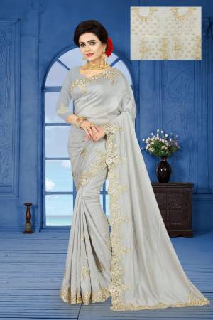Flaunt Your Rich And Elegant Taste Wearing This Designer Saree In Grey Color Paired With Grey Colored Blouse. This Saree IS Fabricated On Sparkle Silk Paired With Net And Art Silk Blouse. It Also Ensures Superb Comfort Throughout The Gala.