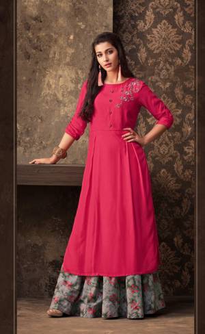 Shine Bright Wearing This Designer Pair Of Kurti And Skirt Which IS Fully Stitched And Available In Sizes. Its Kurti Is In Dark Pink Color Paired With Grey Skirt. It Is Muslin Based Fabric Beautified With Prints And Resham Work.