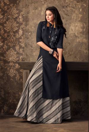For A Bold And Beautiful Look, Grab this Designer Readymade Kurti With Skirt. Its Kurti Is Black In Color Paired With Grey Skirt. This Kurti And Skirt Are Muslin Fabricated Which Ensures Superb Comfort All Day Long.