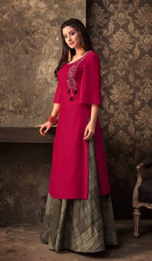 Bright And Visually Appealing Color Is Here With This Designer Pair Of Kurti And Skirt. This Kurti Is In Magenta Pink Color With Bell Sleeve Pattern Paired With Dark Grey Colored Skirt . Its Muslin Fabric Is Light Weight And Easy To Carry All Day Long.