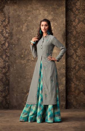 Flaunt Your Rich And Elegant Taste Wearing This Designer Readymade Pair Of Kurti And Skirt. Its Kurti Is In Grey Color Paired With Blue Colored Skirt. Its IS Muslin Based Fabric Which Ensures Superb Comfort All Day Long.