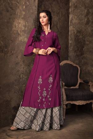 Shine Bright Wearing This Designer Pair Of Kurti And Skirt Which IS Fully Stitched And Available In Sizes. Its Kurti Is In Purple Color Paired With Grey Skirt. It Is Muslin Based Fabric Beautified With Prints And Resham Work.