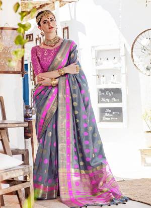 Flaunt Your Rich And Elegant Taste With This Silk Based Saree In Grey Color Paired With Contrasting Rani Pink Colored Blouse. This Saree Is Fabricated On Nylon Silk Paired With Brocade Fabricated Blouse. It Is Beautified With Weave all Over It.