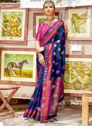 Enhance Your Personality Wearing This Silk Based Saree In Navy Blue Color Paired With Rani Pink Colored Blouse. This Saree IS Fabricated On Nylon Silk Paired With Brocade Fabricated Blouse. Buy Now.