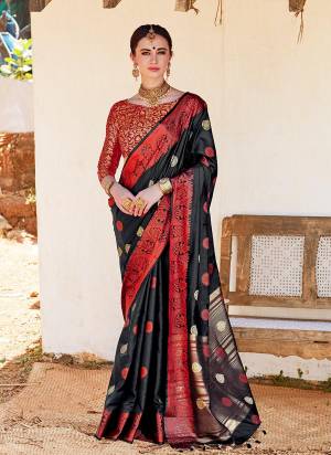 For A Bold And Beautiful Look, Grab This Designer Saree In Black Color Paired With Red Colored Blouse. This Saree Is Nylon Silk Fabricated Paired With Brocade Blouse. Buy Now.