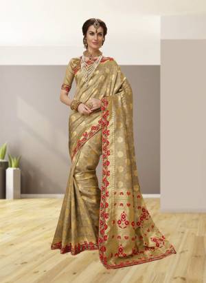 Flaunt Your Rich And Elegant Taste Wearing This Saree In Beige Color Paired With Beige Colored Blouse. This Saree And Blouse Are Fabricated On Jacquard Silk Beautified With Weave And Heavy Embroidery Over The Lace Border. Buy Now.