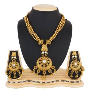 Here Is Beautiful And Royal Looking Necklace Set In Golden Color Beautified with Magenta Pink, Green And White Colored Stone Work. It Is Best Suitable With Silk Saree Which Gives A Rich Look To Your Personality. Buy Now.