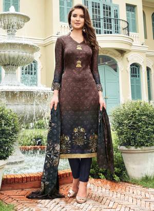 Enhance Your Beauty With Dark Shades In Brown And Dark Grey Colored Top Paired With Dark Grey Colored Bottom And Dupatta. Its Top Is Fabricated On Satin Paired With Crepe Bottom And Chiffon Dupatta. It Has Digital Prints All Over With Fancy Buttons. 
