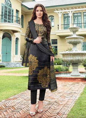 Add This Lovely Designer Digital Printed Straight Suit Yo Your Wardrobe In Dark Grey Color Paired With Dark Grey Colored Bottom And Dupatta.Its Top Is Satin Fabricated Paired With Crepe Bottom And Chiffon Dupatta. 