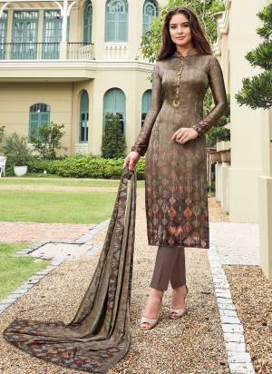 Simple And Elegant Looking Straight Suit Is Here In Beige Color Paired With Beige Colored Bottom And Dupatta. Its Top Is Fabricated On Satin Paired With Crepe Bottom And Chiffon Dupatta. It Is Beautified With Digital Prin