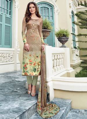 This Season Is About Subtle Shades And Pastel Play, Grab This Designer Digital Printed Suit In Beige Color Paired With Pastel Green Colored Bottom And Beige Colored Dupatta. Its Top Is Fabricated On Satin Paired With Crepe Bottom And Chiffon Dupatta. Buy This Semi-Stitched Suit.