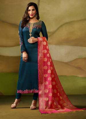 Get Ready For The Upcoming Festive and Wedding Season Wearing This Designer Straight Suit In Blue Color Paired With Blue Colored Bottom And Contrasting Dark Pink Colored Dupatta. Its Top Is Fabricated On Satin Georgette Paired With Santoon Bottom And Banarasi Silk Dupatta. Buy Now.