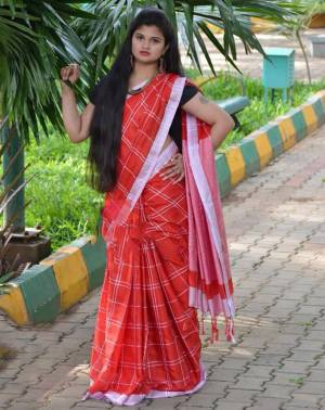 For Your Casual Or Semi-Casual Wear, Grab This Pretty Light Weight Saree In Red Color Paired With Black Colored Blouse. This Saree And Blouse Are Fabricated On Cotton Linen Beautified With Checks Prints all Over. 