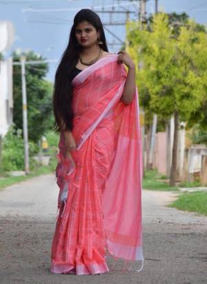 For Your Casual Or Semi-Casual Wear, Grab This Pretty Light Weight Saree In Pink Color Paired With Black Colored Blouse. This Saree And Blouse Are Fabricated On Cotton Linen Beautified With Checks Prints all Over. 