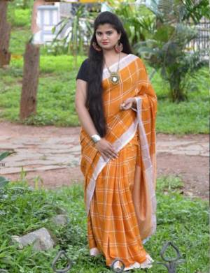 For Your Casual Or Semi-Casual Wear, Grab This Pretty Light Weight Saree In Musturd Yellow Color Paired With Black Colored Blouse. This Saree And Blouse Are Fabricated On Cotton Linen Beautified With Checks Prints all Over. 