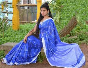 Grab This Pretty Saree In Blue Color Paired With Black Colored Blouse. This Saree And Blouse Are Fabricated On Cotton Linen Beautified With Checks Prints all Over. 