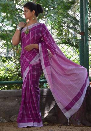 For Your Casual Or Semi-Casual Wear, Grab This Pretty Light Weight Saree In Purple Color Paired With Black Colored Blouse. This Saree And Blouse Are Fabricated On Cotton Linen Beautified With Checks Prints all Over. 