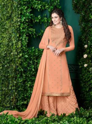 A Must Have Shade In Womens Wardrobe Is Here With This Designer Plazzo Suit In Peach Color Paired With Peach Colored Bottom And Dupatta. Its Top And Bottom Are Georgette Fabricated Paired With Chiffon Dupatta Beautified with Heavy Embroidery .