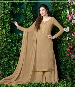 Flaunt Your Rich And Elegant Taste Wearing This Designer Plazzo Suit In Beige Color Paired With Beige Colored Bottom And Dupatta. This Rich Color And Georgette Fabric Will Earn You Lots Of Compliments From Onlookers. Buy Now.