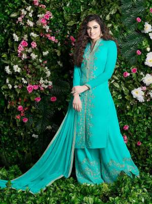 Celebrate This Festive Season With And Comfort With This Plazzo Suit In Turquoise Blue Color Paired With Turquoise Blue Colored Dupatta. Its Top And Bottom Are Georgette Based Paired With Chiffon Dupatta. It Is Beautified With Jari Embroidery And Stone Work. 