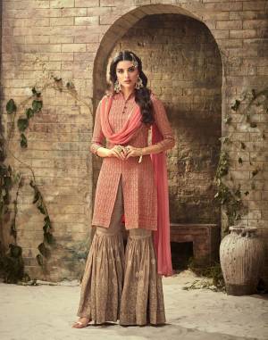Look Pretty Wearing This Designer Semi-Stitched Suit In Pink Colored Top And Dupatta Paired With Contrasting Sand Grey Colored Sharara. Its Heavy Embroidered Top And Bottom are Fabricated On Georgette Paired With Chiffon Dupatta. Buy Now.
