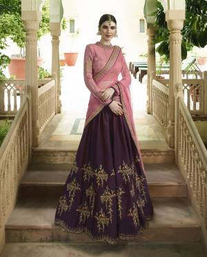 Look Prettiest Amongst All Wearing This Beautiful Designer Heavy Lehenga Choli In Pink colored Blouse And Dupatta Paired With Contrasting Wine Colored Lehenga. Both  The Complimenting Colors Will Earn You Lots Of Compliments From Onlookers.