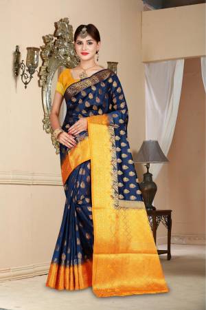 Enhance Your Personality Wearing This Beautiful Silk Based Saree In Navy Blue Color Paired With Contrasting Musturd Yellow Colored Blouse. It Is Beautified With Weave All Over.
