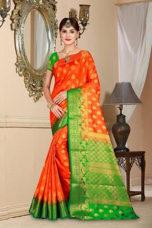 Bright And Visually Appealing Color Is Here With This Art Silk Based Saree In Orange Color Paired With Contrasting Green Colored Blouse. This Rich Saree Will Give An Attractive Look To Your Personality.