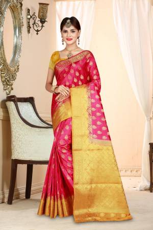 Shine Bright In This Lovely Rani Pink Colored Saree Paired With Contrasting Yellow Colored Blouse. This Saree And Blouse Are Art Silk Based Beautified With Weave All Over. 