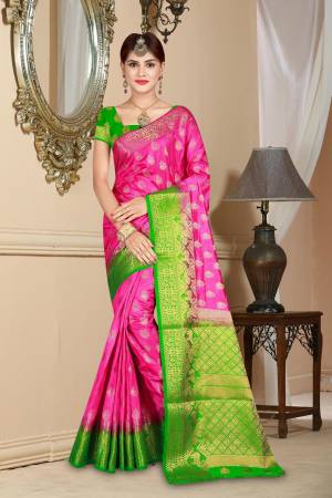 Shine Bright In This Lovely Rani Pink Colored Saree Paired With Contrasting Green Colored Blouse. This Saree And Blouse Are Art Silk Based Beautified With Weave All Over. 