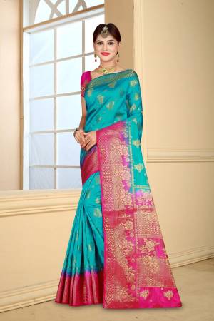 Simple And Elegant Looking Pretty Saree Is Here In Turquoise Blue Color Paired With Contrasting Rani Pink Colored Blouse. This Saree And Blouse Are Art Silk Based Beautified With Weave All Over. 