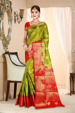 A Must Have Shade In Every Womens Wardrobe Is Here With This Art Silk Based Saree In Olive Green Color Paired With Contrasting Red Colored Blouse. This Saree And Blouse Are Beautified With Attractive Weave.